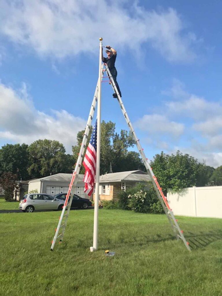 flagpole repair on 25' ladder